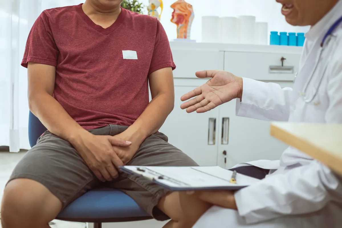 A patient consulting a men’s health specialist